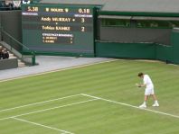 Andy Murray in front of Wimbledon Scoreboard